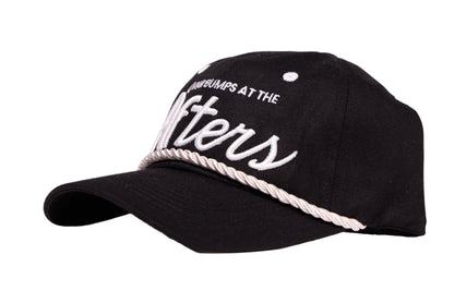 Black dad hat with white text script on a white background.  Text reads Caviar Bumps at the Afters