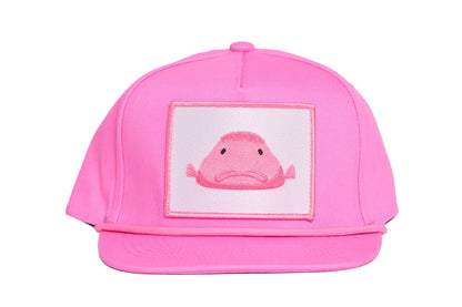 Light pink flat-bill hat with a pink blobfish patch