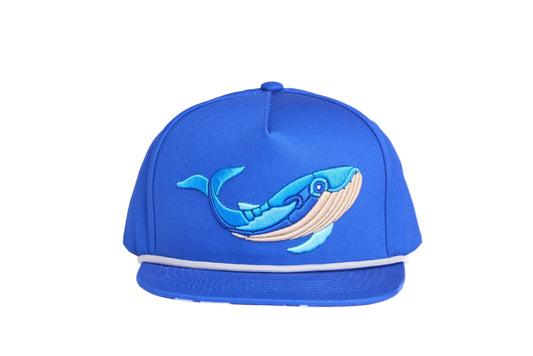 Blue flat-bill hat with embroidered blue whale design and a breaking wave design on the underside of the bill