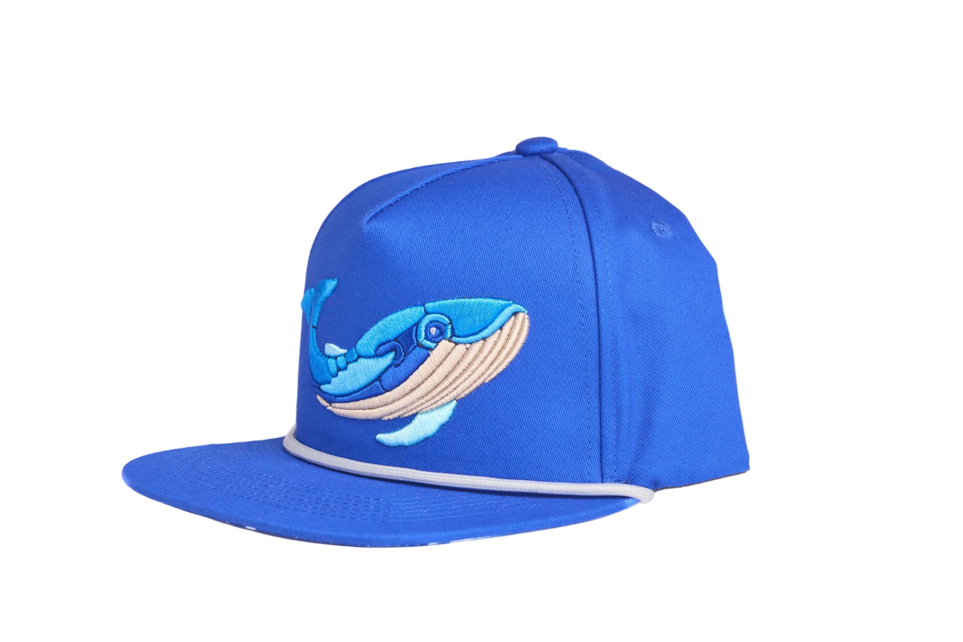 Blue flat-bill hat with embroidered blue whale design and a breaking wave design on the underside of the bill