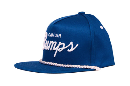 Navy blue flat bill hat with 'Caviar Bumps' text on a white background