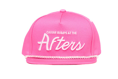Pink flat brim hat with 90s script that readys Caviar Bumps at the afters