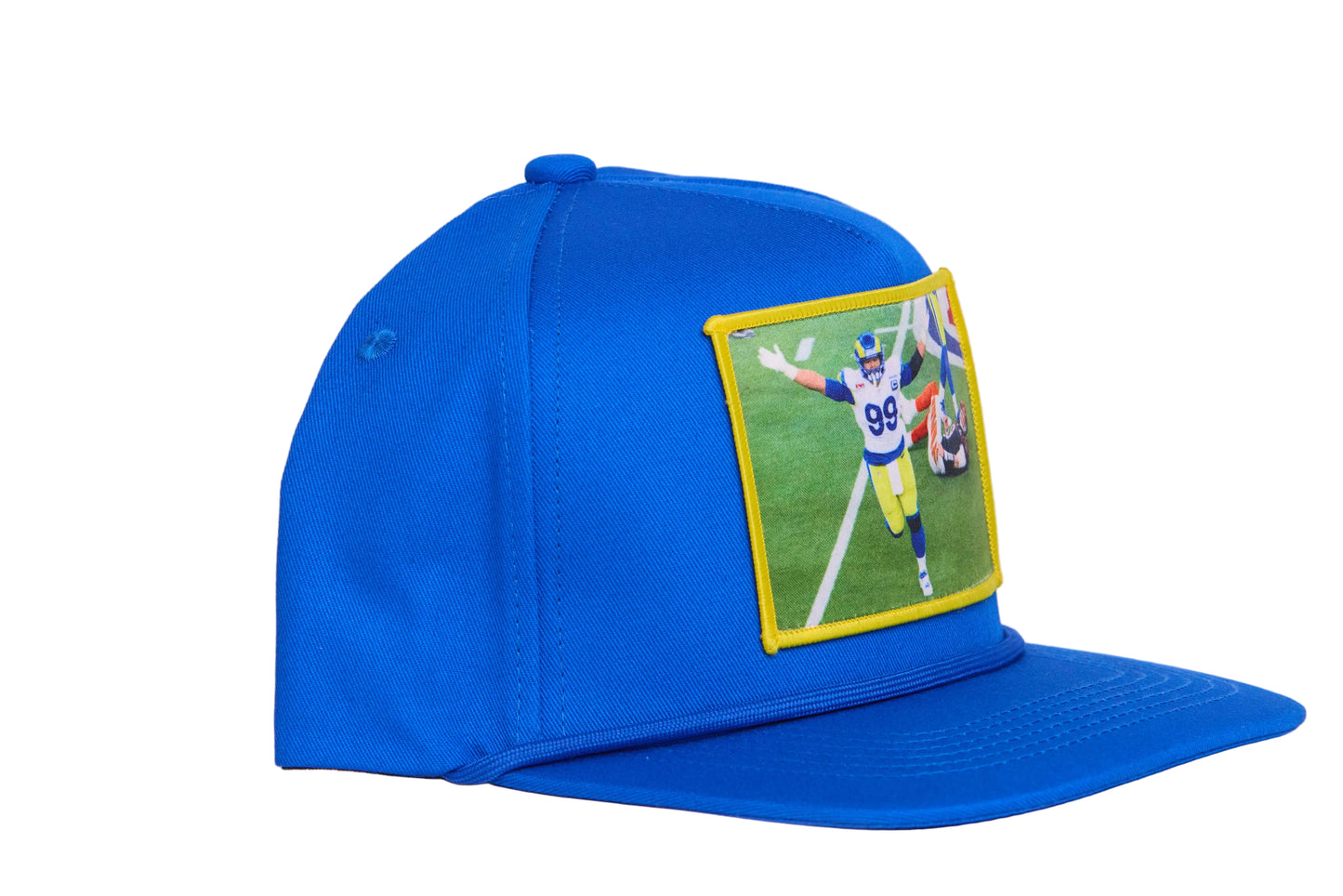 Blue hat with a patch featuring Aaron Donald celebrating a sack to win the Super Bowl
