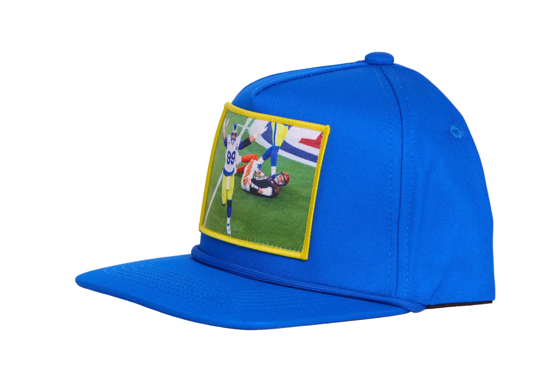 Blue hat with a patch featuring Aaron Donald celebrating a sack to win the Super Bowl
