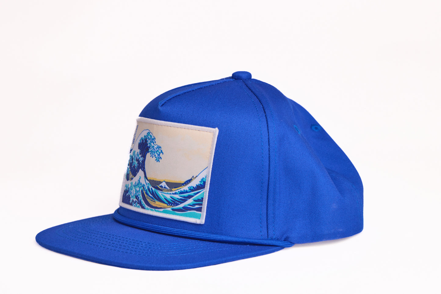 Blue cap featuring Hokusai's iconic painting of The Great Wave off Kanagawa from the series 36 views of Mt. Fuji