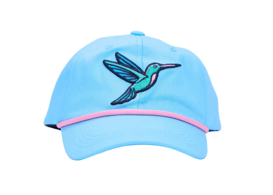 A light blue baseball cap featuring an embroidered hummingbird on the front with a pink accent line along the edge of the brim, set against a plain white background.