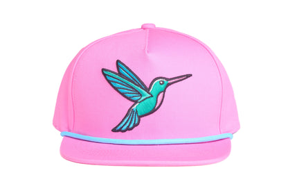 Pink flat bill hat with an embroidered hummingbird design 