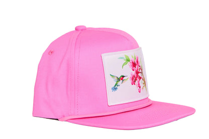 Pink hat with a patch of a hummingbird and flowers