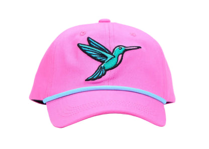 A bright pink baseball cap featuring an embroidered teal and black hummingbird on the front and a light blue stripe along the edge of the curved brim, set against a plain white studio background.