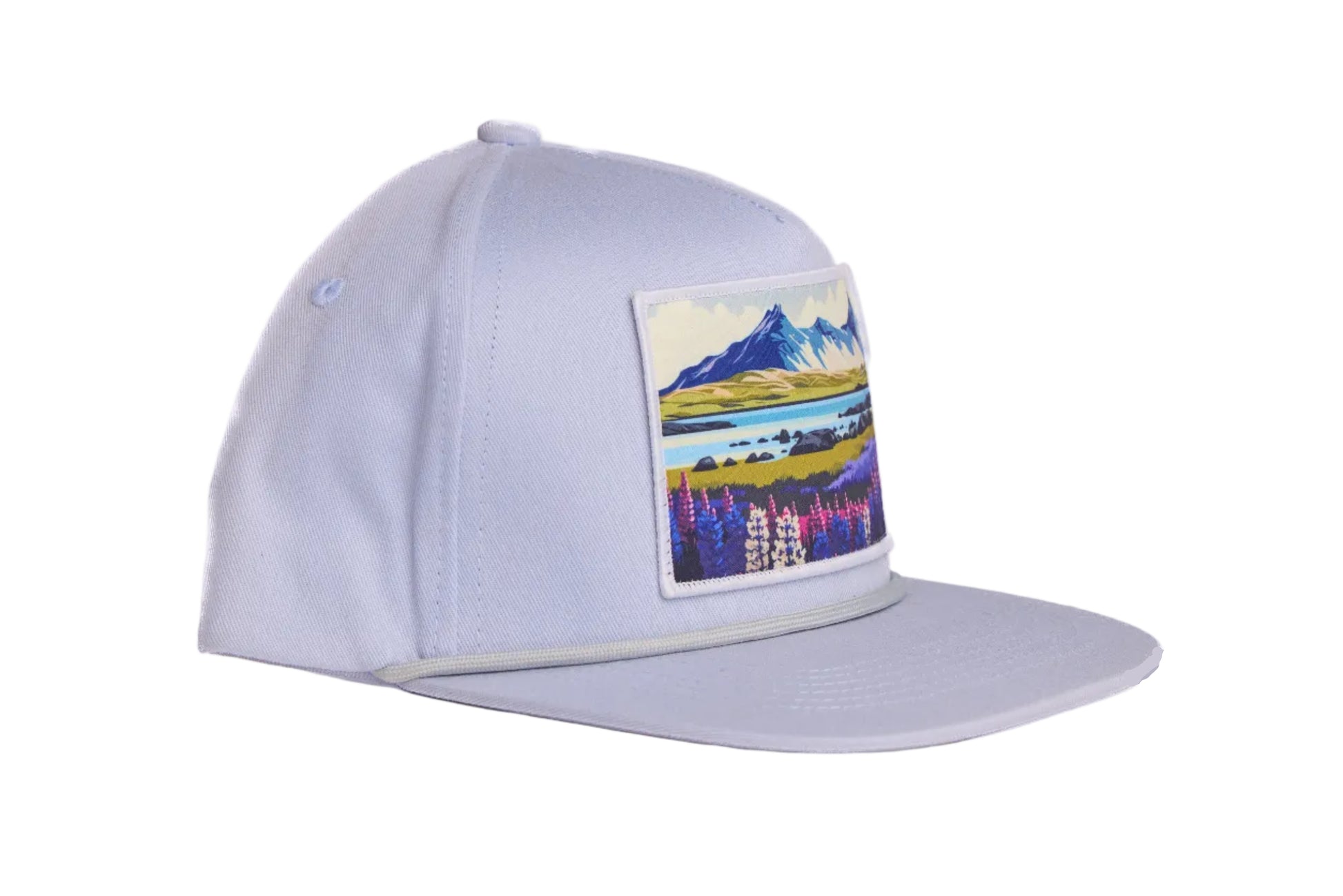 Grey flat-billed hat with a scenic patch featuring mountains and flowers from the southern coast of Iceland