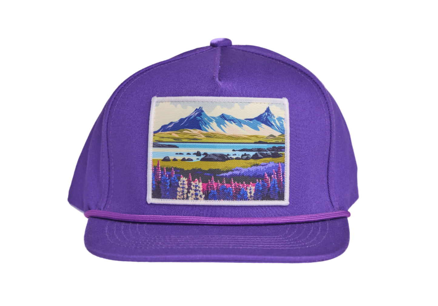 Purple flat-billed hat with a scenic patch featuring mountains and flowers from the southern coast of Iceland
