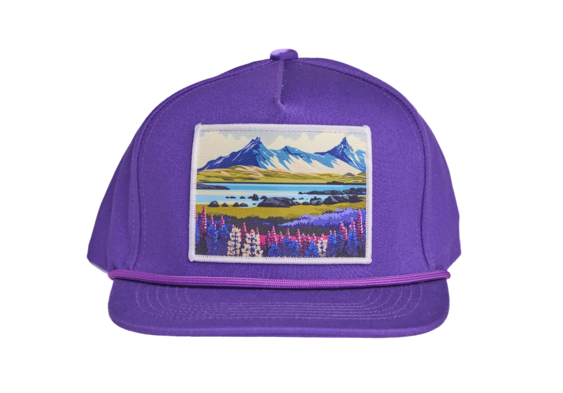 Purple flat-billed hat with a scenic patch featuring mountains and flowers from the southern coast of Iceland
