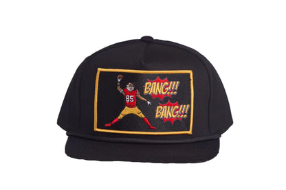 Black hat with George Kittle spiking a football with a Bang Bang 