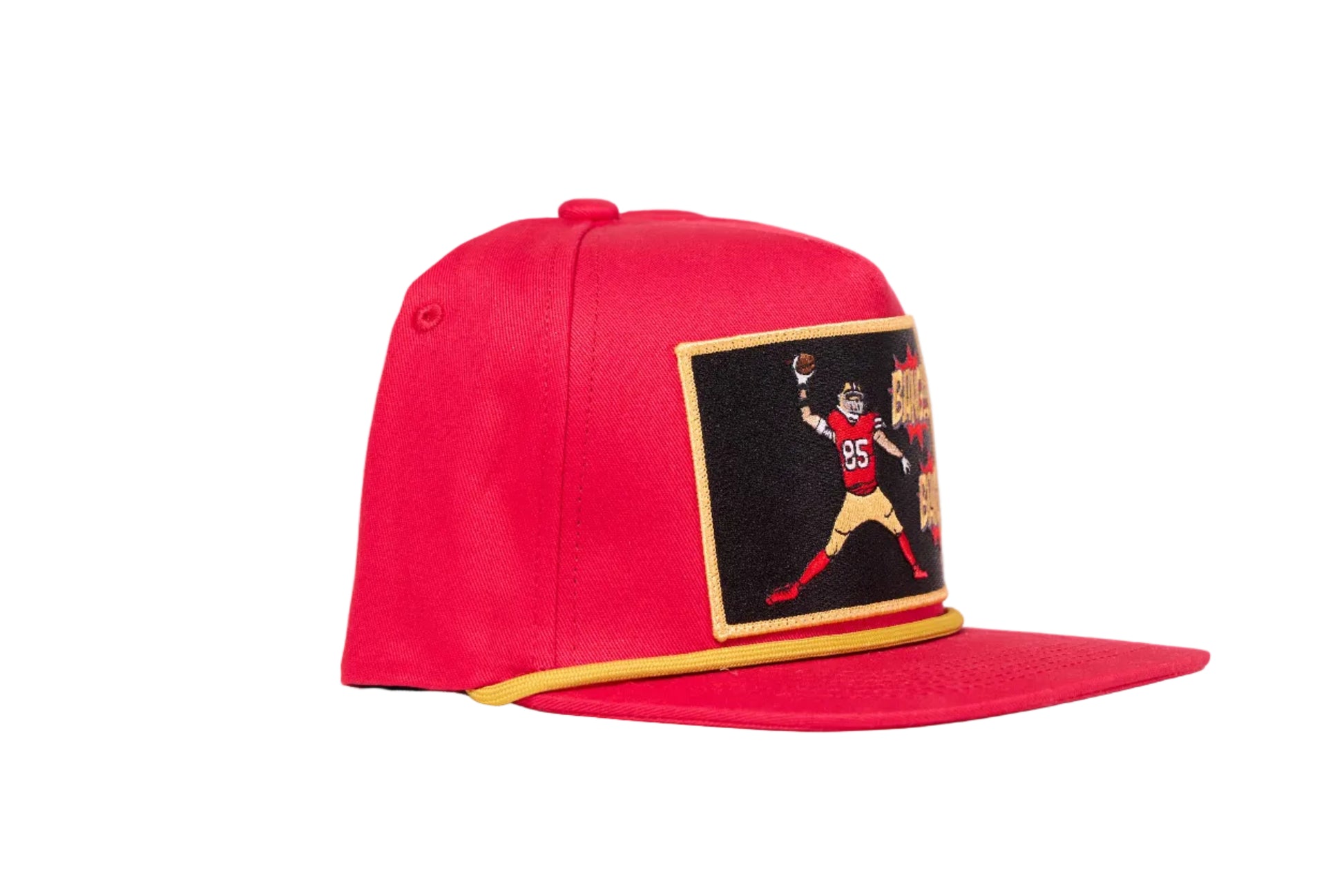 Red hat with George Kittle spiking a football with a Bang Bang 