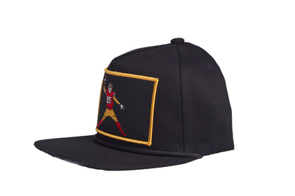 Black flat-bill hat with George Kittle spiking a football patch