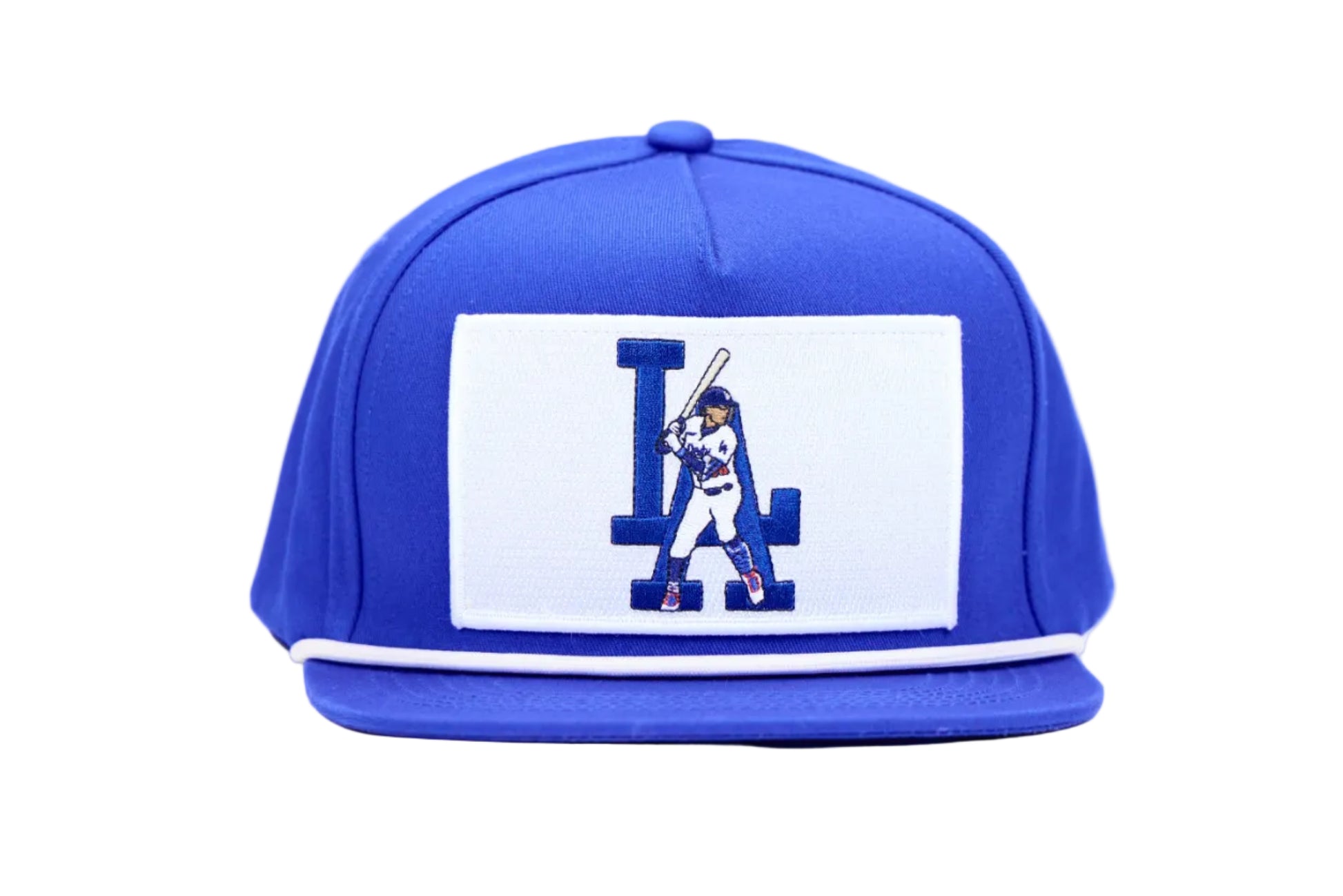 A royal blue flat-brim baseball cap featuring a white rectangular patch on the front with a blue and white 'LA' logo and a baseball player graphic, set against a plain white background.
