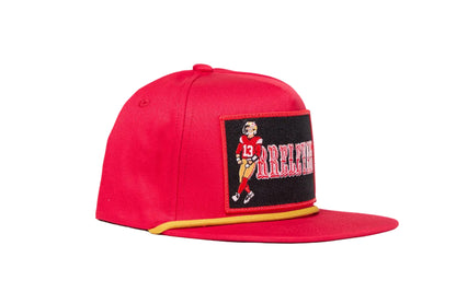 Red flat-bill hat with Brock Purdy Mr. Irrelevant patch