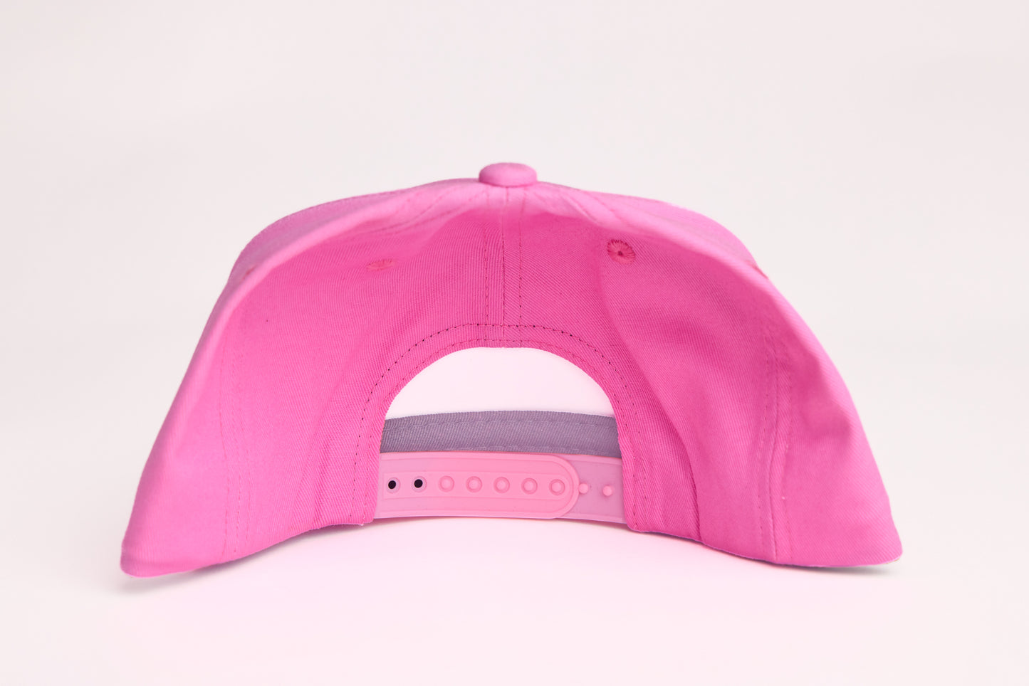 Pink hat with a Rainbow wave design patch