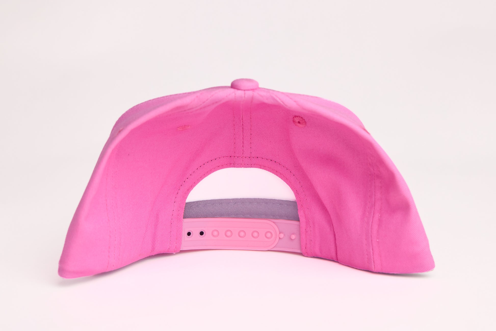Pink hat with a Rainbow wave design patch