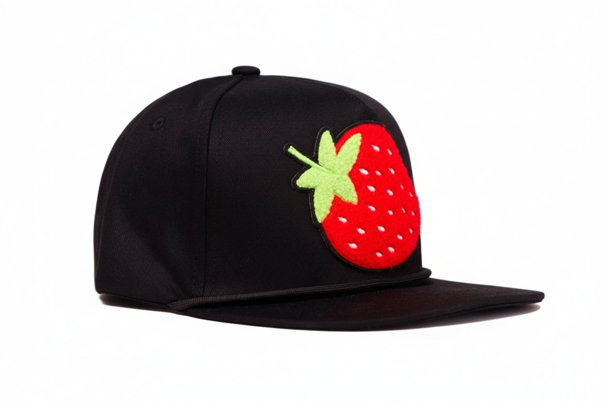 Black flat-bill hat with a strawberry chenille patch