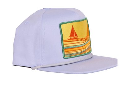 A grey structured baseball cap with a flat brim, featuring a square embroidered patch on the front with a yellow background, a red sailboat, and orange and green striped waves.