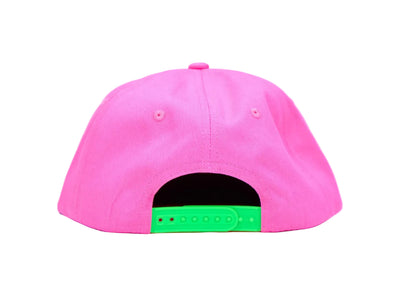 A bright pink baseball cap viewed from the back, featuring a contrasting green plastic snapback closure on a clean white background.