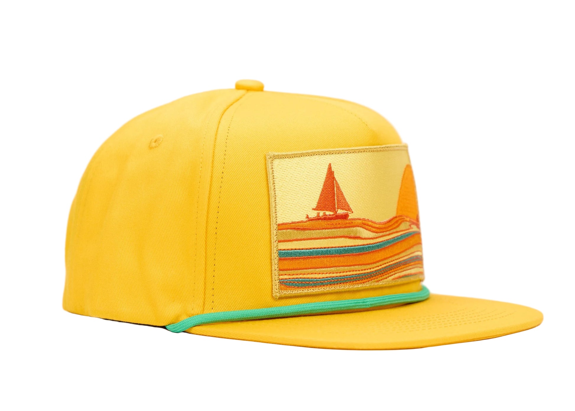 A bright yellow flat-brim cap with a rectangular embroidered patch on the front depicting a sailboat and striped waves. A thin mint green trim accents the edge of the brim, set against a plain white background.