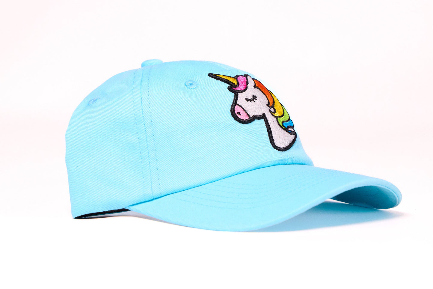 Baby blue dad hat with an embroidered unicorn design