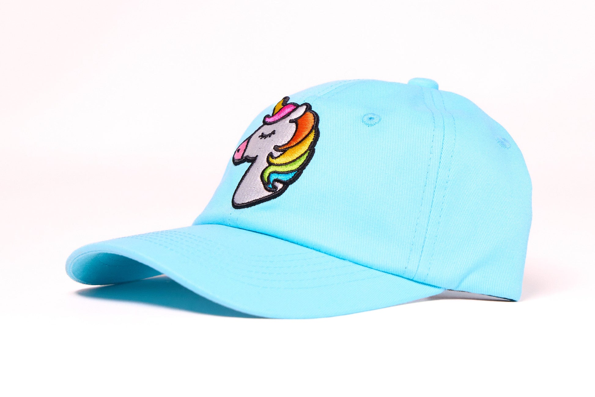 Baby blue dad hat with an embroidered unicorn design