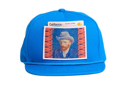 Blue flat-bill hat featuring a patch of Vincent Van Gogh's self portrait in grey felt hat