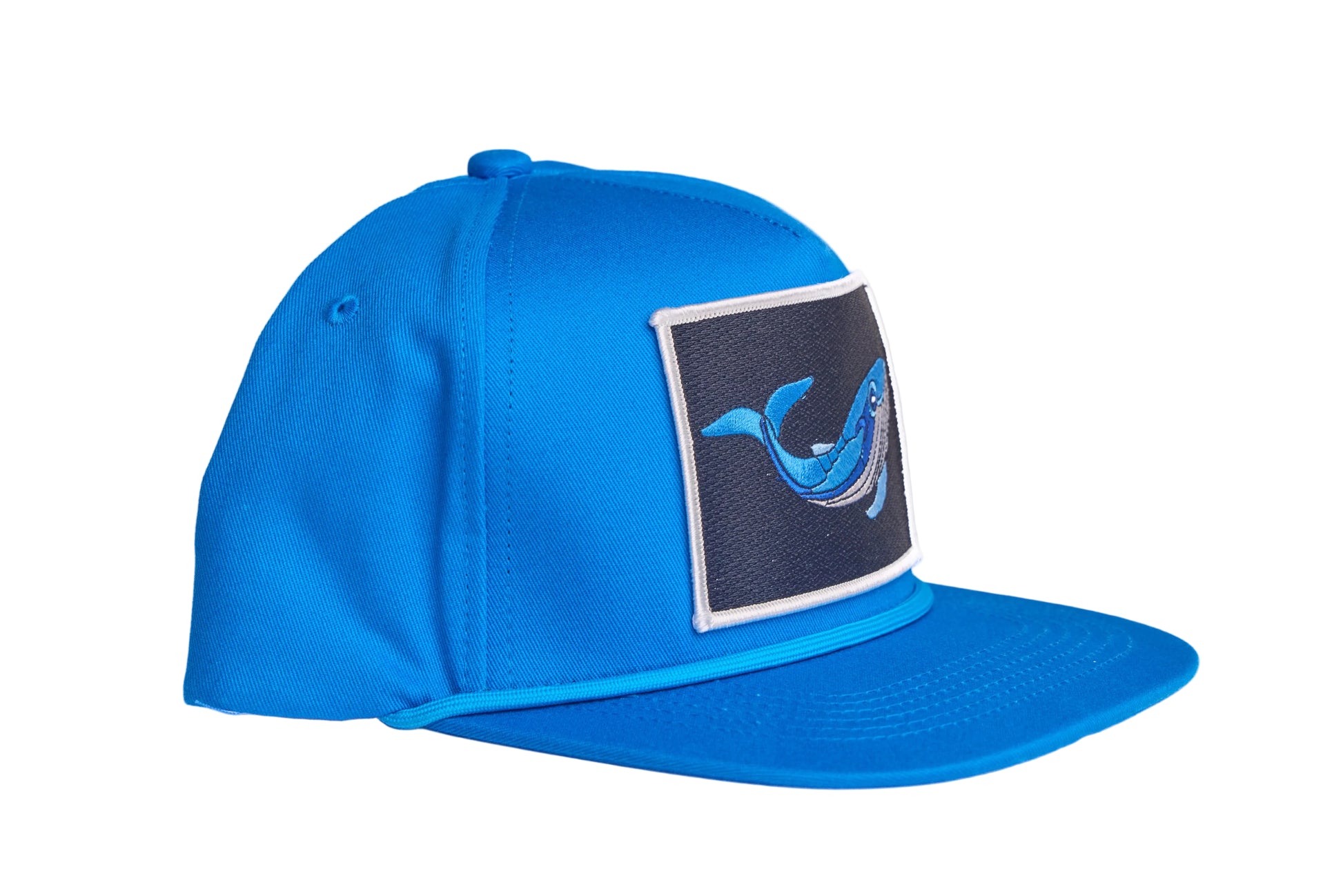 Blue flat-bill hat with a whale patch