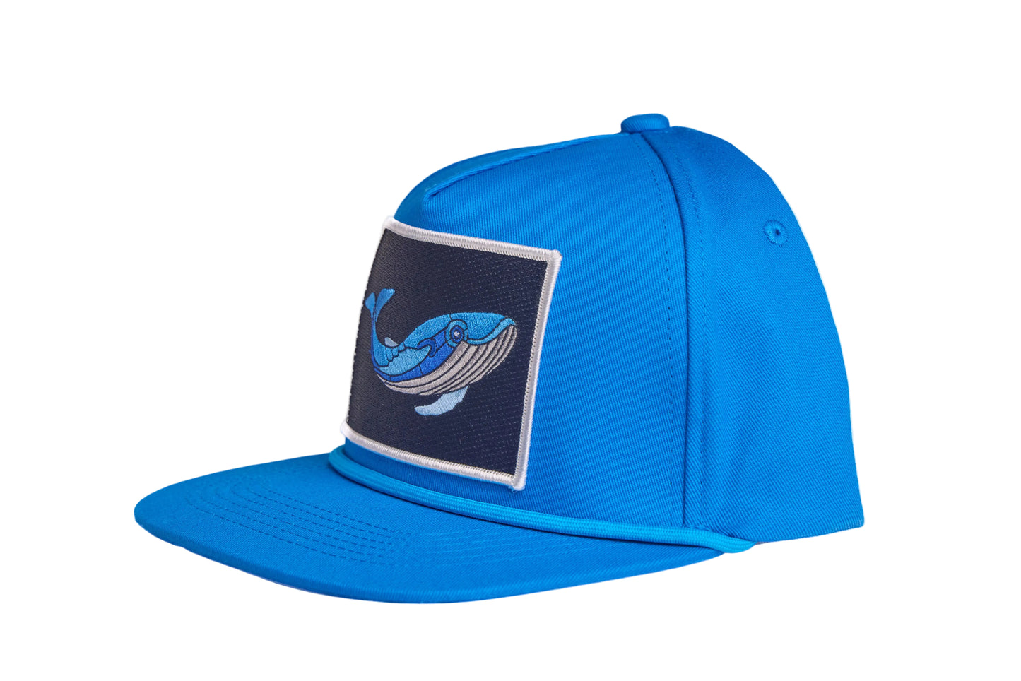 Blue flat-bill hat with a whale patch